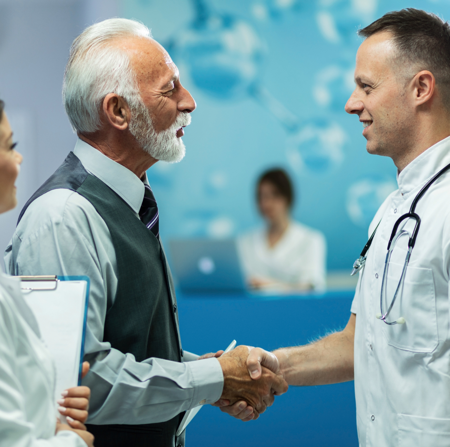 personal care aide shaking hands with elderly man