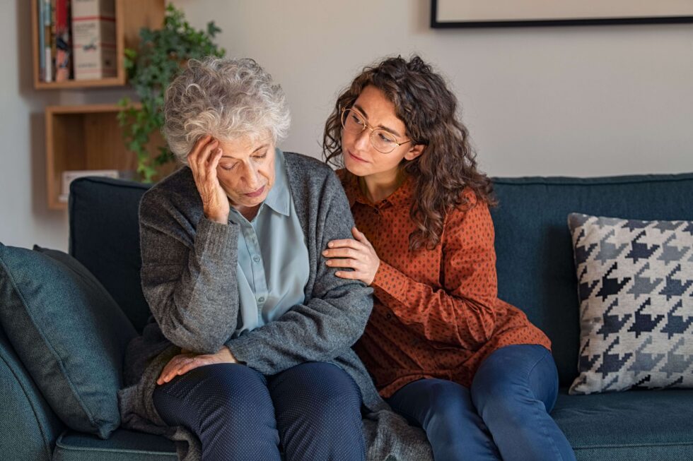 woman supporting elderly loved one with depression