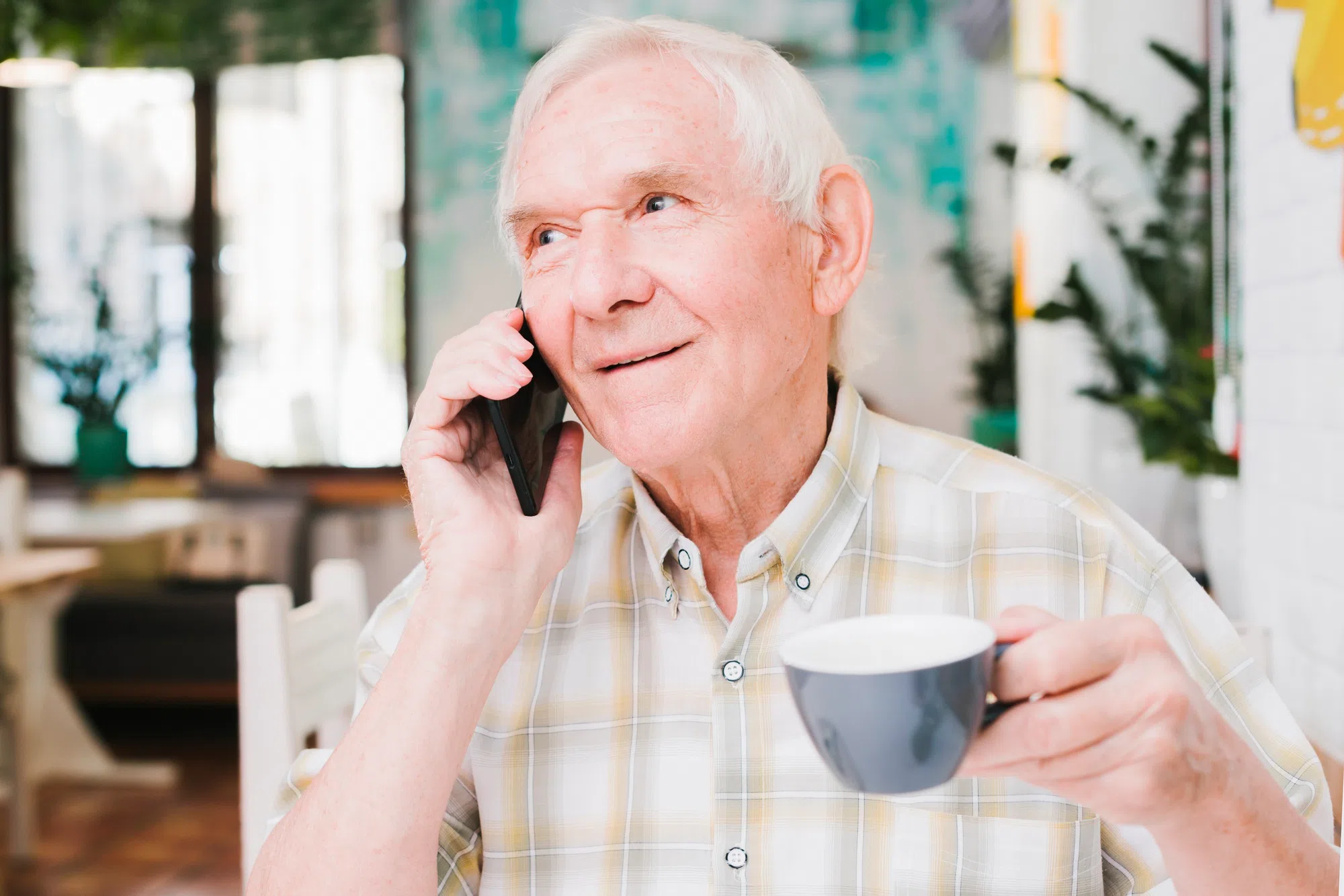 elderly man giving health updates over the phone