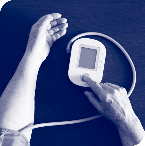 A person uses a blood. pressure monitor