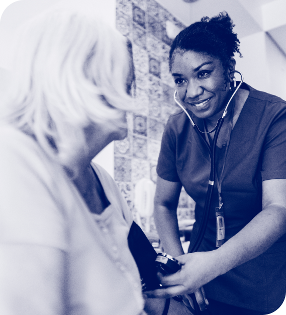 A doctor wearing a stethescope and checking a patient