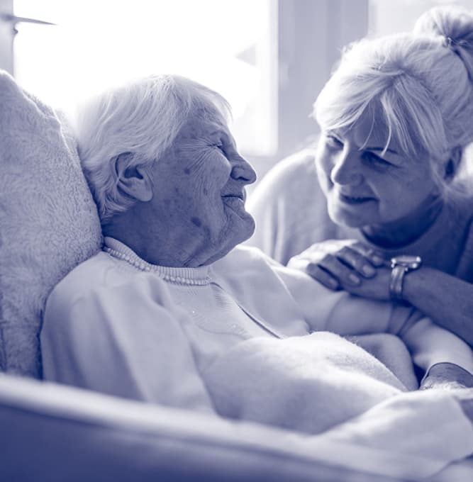 elder couple smiling at one another